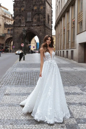 Boho White Wedding Dress A-Line V-Neck Appliques Spagetti Straps Bridal Gowns Dubai Backless Brides Dress Custom Made Floor Length
