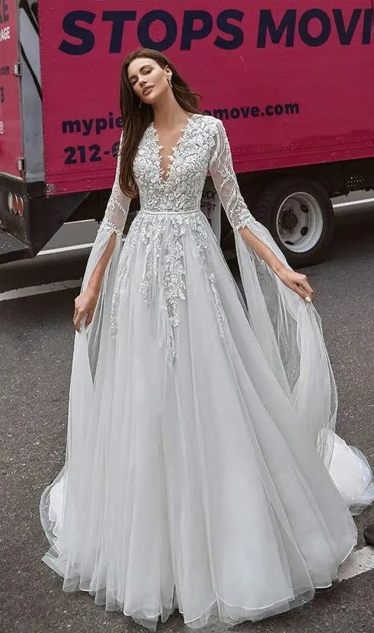 Real fairy gown for a romantic bride. The corset is embroidered with silver sequins and 3D lace and has V-neckline. The decorations proceed to the sleeves, that end with long straps of Tulle.