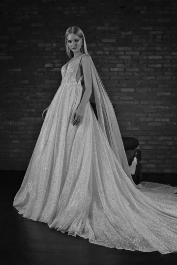 Ethereal A-Line Wedding Gown with Spaghetti Straps, Graceful V-Neckline, and Sparkling Lace Details for a Breathtaking Bridal Look