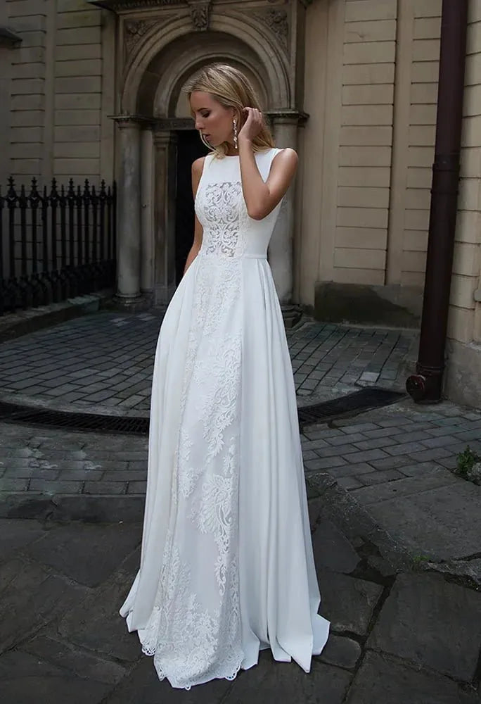 Sleek Sheath Wedding Gown with Strapless Jewel Neckline, Exquisite Lace Detailing, and a Flattering Dropped Waist for a Sophisticated and Timeless Bridal Look