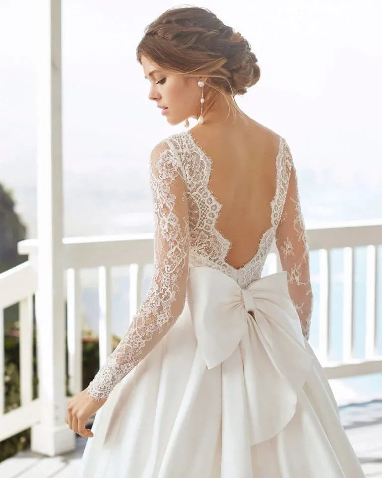 Ethereal A-Line Wedding Gown with Long Sleeves, Delicate Illusion Neckline, and Exquisite Lace Detailing for a Graceful and Timeless Bridal Look