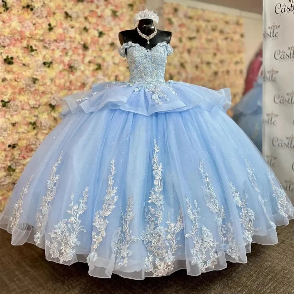 Vestido De quinceañera azul brillante con volantes y hombros descubier