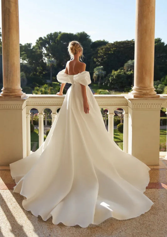 A Line dress with puffed sleeves and a wrap skirt.