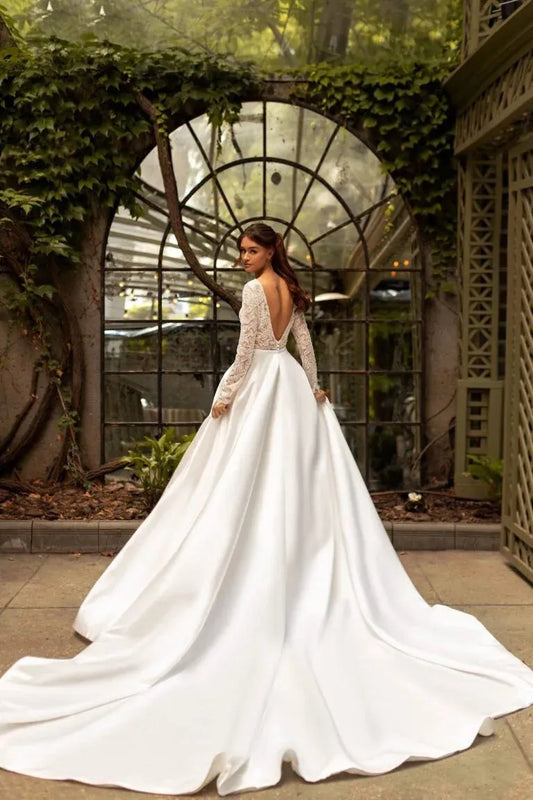 Timeless A-Line Wedding Gown with Long Sleeves, V-Neckline, and a Flattering Dropped Waist for an Elegant Bridal Look