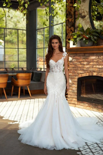Elegant Mermaid Wedding Gown with Spaghetti Straps, Halter Neckline, and a Flattering Dropped Waist for a Captivating Bridal Look