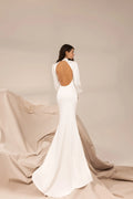 Modern Minimalist Wedding Dress with Sleek Satin, High Neckline & Elegant Open Back with Delicate Button Details for a Sophisticated Bridal Look