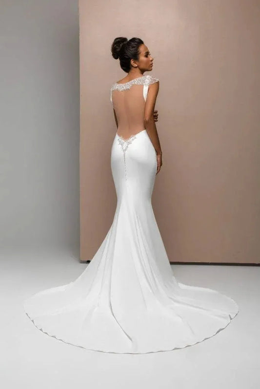 Romantic Mermaid Wedding Gown with Straps, Boat Neckline, and Lace Embellishments for a Timeless Bridal Look