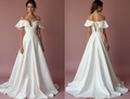 Modern White Princess Wedding Dress with a Plunging Neckline and Elegant Design
