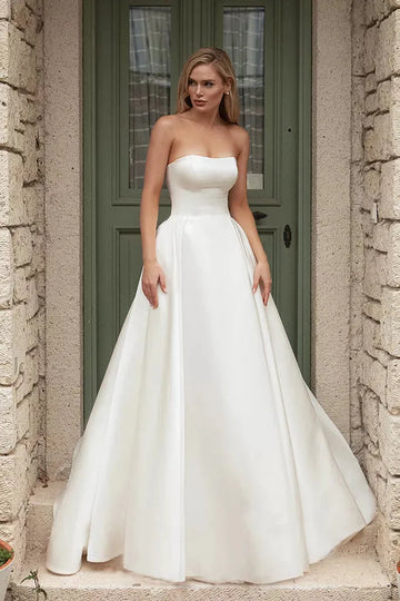 Romantic A-Line Wedding Gown with a Graceful Off-Shoulder Neckline, and a Flattering Natural Waistline for an Enchanting and Timeless Bridal Look - Camilla's