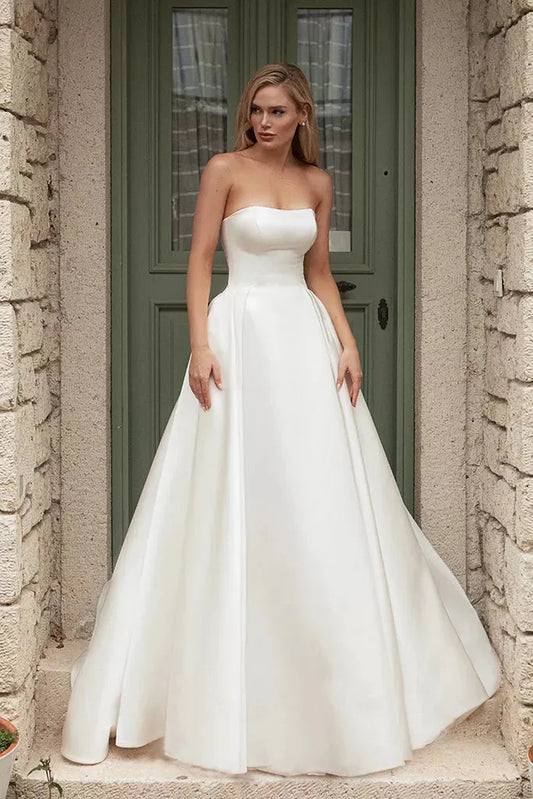 Romantic A-Line Wedding Gown with a Graceful Off-Shoulder Neckline, and a Flattering Natural Waistline for an Enchanting and Timeless Bridal Look