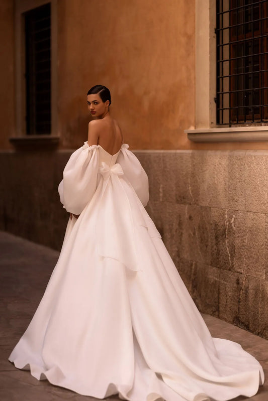 Elevate your bridal look with our enchanting A-line wedding dress, a harmonious blend of elegance and modernity.