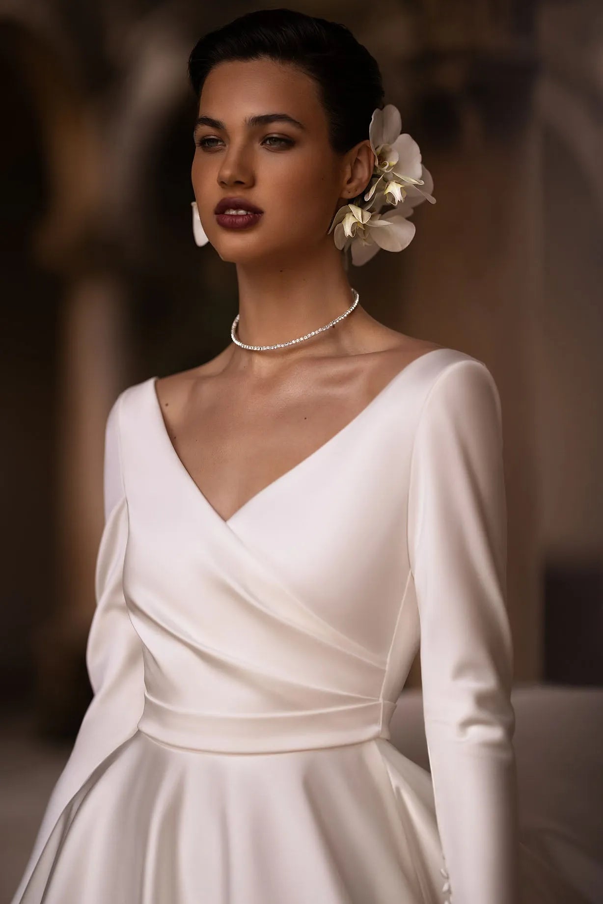 Introducing our exquisite A-line wrap wedding dress, a harmonious blend of modernity and classic elegance. Crafted from luxurious glossy fabric, it drapes gracefully to accentuate your silhouette with a sense of refined beauty.