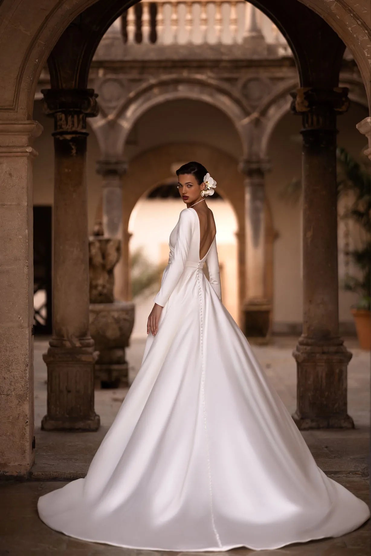Introducing our exquisite A-line wrap wedding dress, a harmonious blend of modernity and classic elegance. Crafted from luxurious glossy fabric, it drapes gracefully to accentuate your silhouette with a sense of refined beauty.
