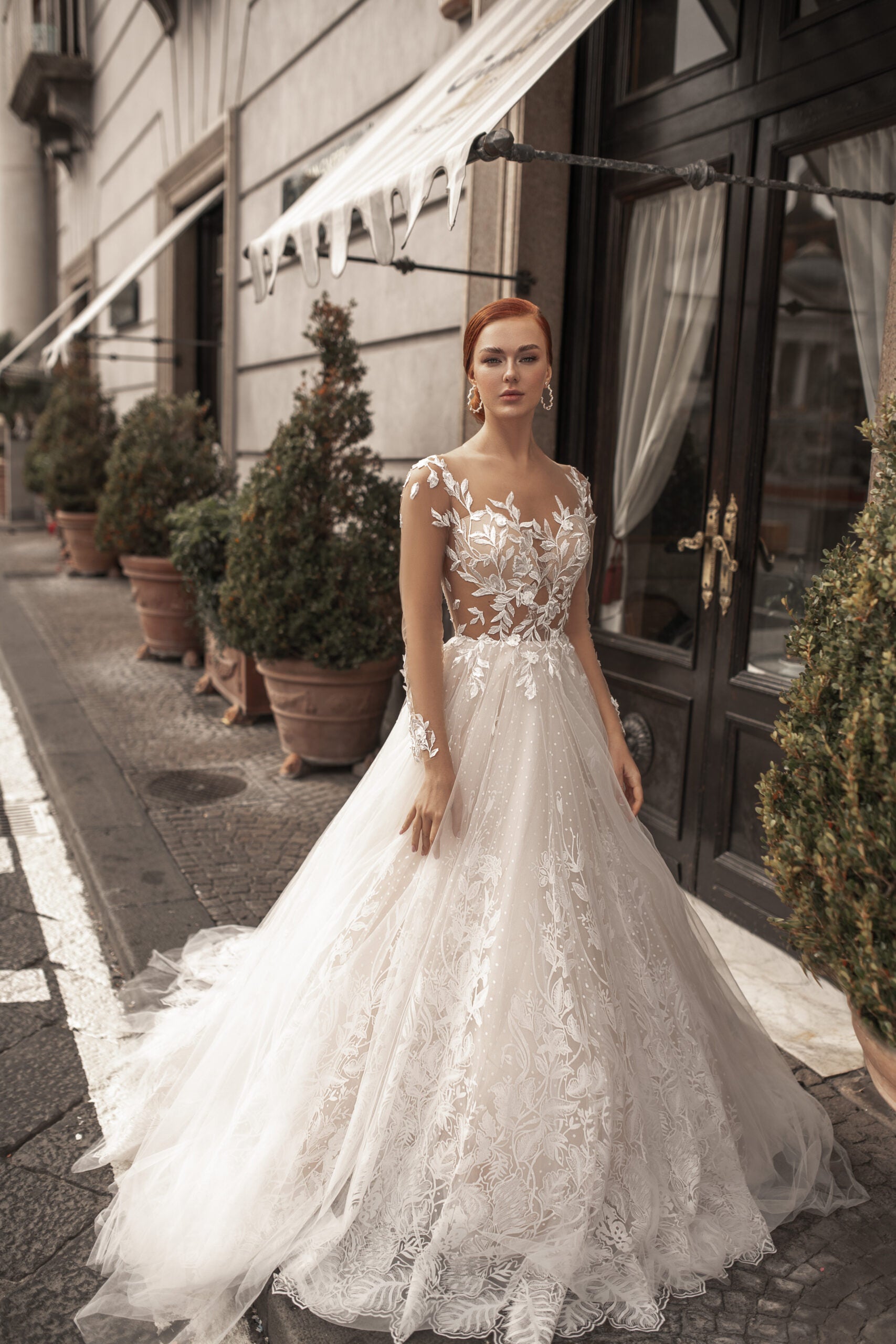 Ethereal A-Line Wedding Gown with Illusion Sleeves, Button Detailing, and a Romantic Puffy Silhouette