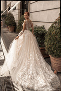 Ethereal A-Line Wedding Gown with Illusion Sleeves, Button Detailing, and a Romantic Puffy Silhouette