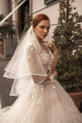 Ethereal A-Line Wedding Gown with Illusion Sleeves, Button Detailing, and a Romantic Puffy Silhouette