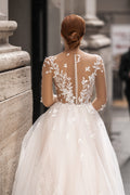 Ethereal A-Line Wedding Gown with Illusion Sleeves, Button Detailing, and a Romantic Puffy Silhouette