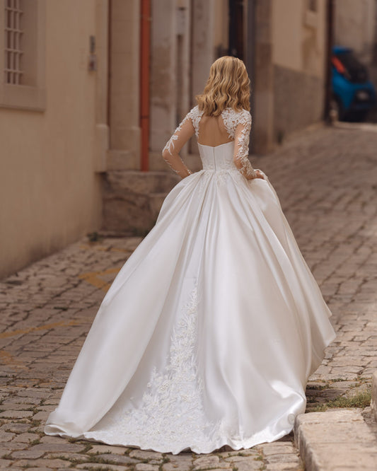 Exquisite A-Line Wedding Gown with Elegant Long Sleeves, a Dreamy Illusion Neckline, and Intricate Beaded Lace for a Timeless and Romantic Bridal Look