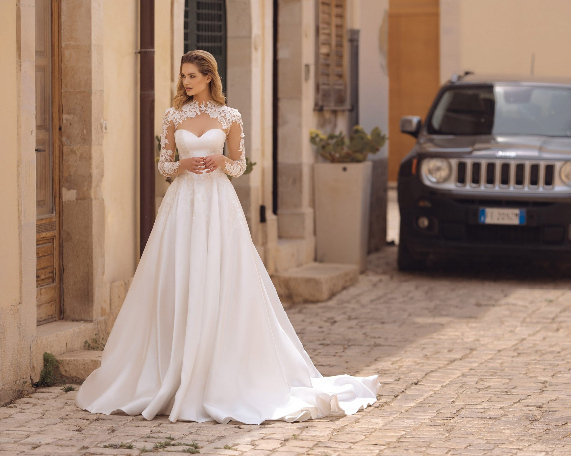 Exquisite A-Line Wedding Gown with Elegant Long Sleeves, a Dreamy Illusion Neckline, and Intricate Beaded Lace for a Timeless and Romantic Bridal Look