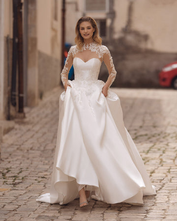 Exquisite A-Line Wedding Gown with Elegant Long Sleeves, a Dreamy Illusion Neckline, and Intricate Beaded Lace for a Timeless and Romantic Bridal Look