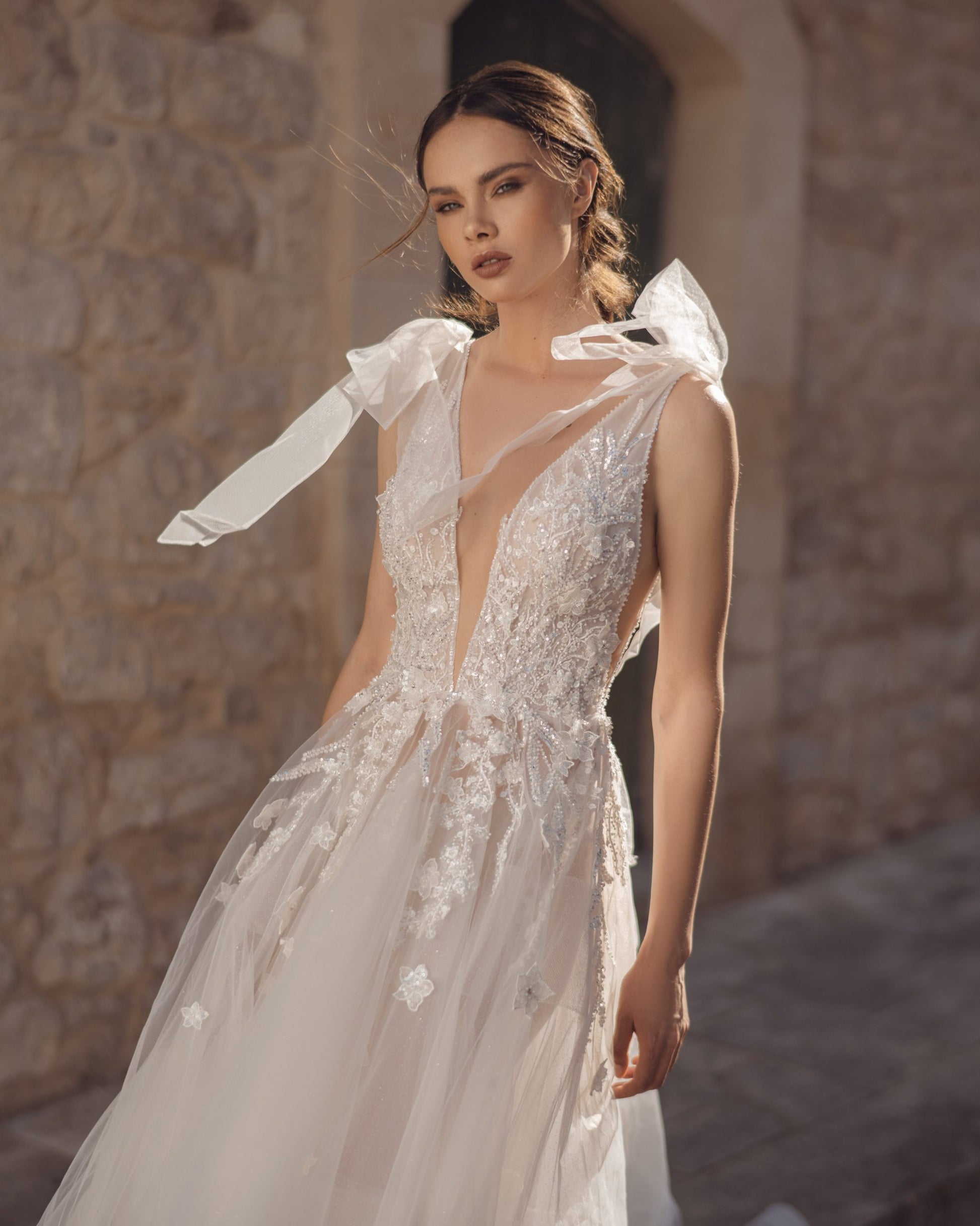 Breathtaking A-Line Wedding Gown with Exquisite Lace, Romantic Cap Sleeves, and a Flattering V-Neckline for an Effortlessly Elegant Bridal Look