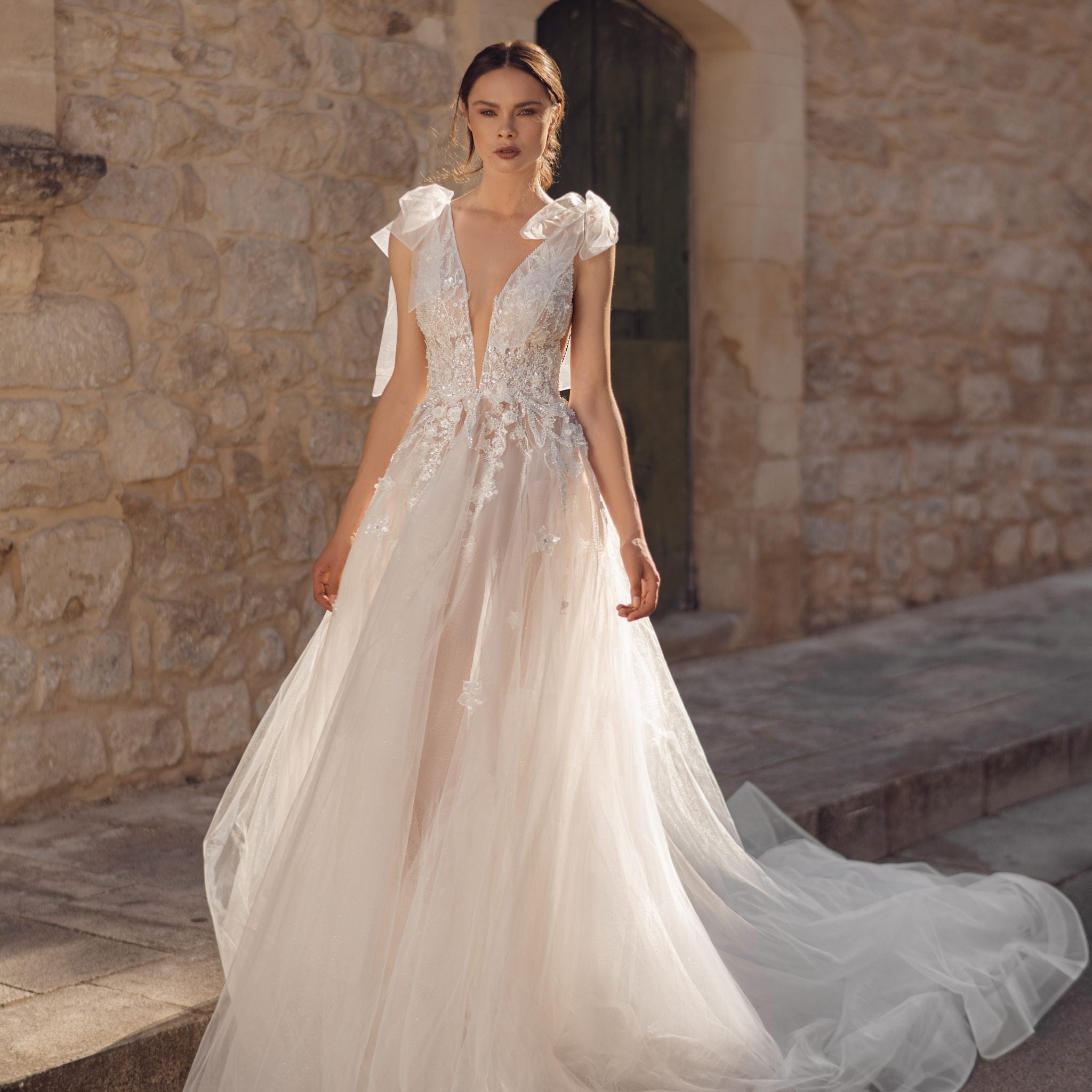 Breathtaking A-Line Wedding Gown with Exquisite Lace, Romantic Cap Sleeves, and a Flattering V-Neckline for an Effortlessly Elegant Bridal Look