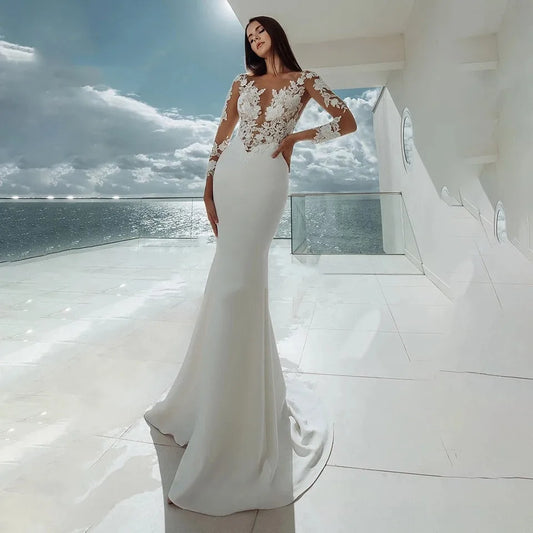 Långa ärmar sjöjungfru bröllopsklänningar vit sexig illusion halsspets applikationer eleganta brudklänning klänningar strand vestidos de noiva