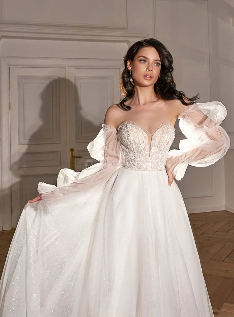 Classic A-Line Bridal Gown with Long Sleeves, Nude Neckline, Lace Embellishments, and Natural Waistline