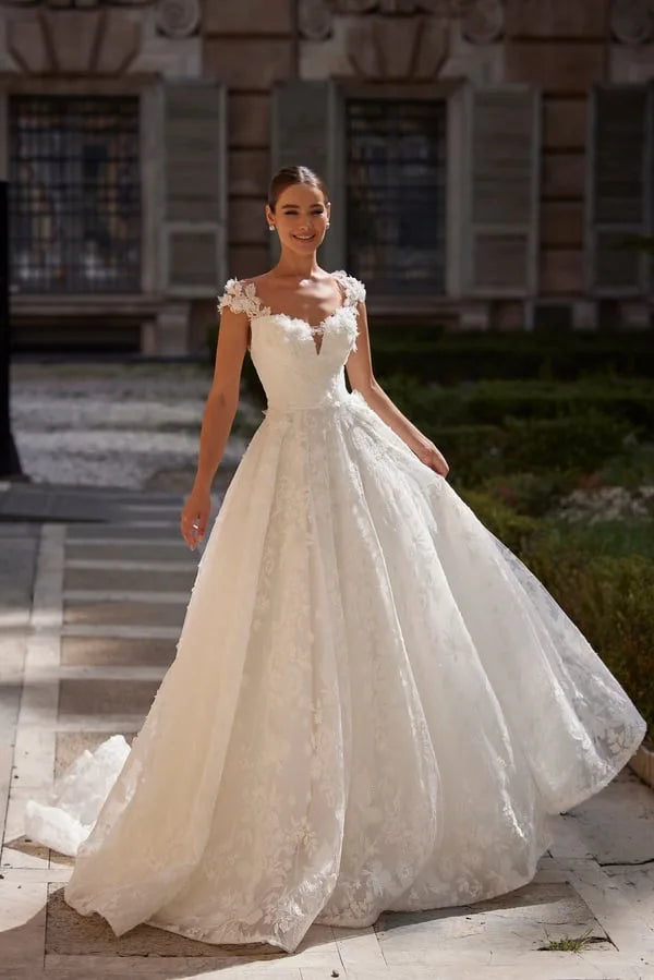 Beautiful A-Line Wedding Dress with Straps, Square Neckline, and Pearl Embellishments