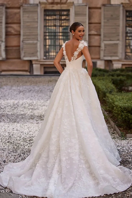 Beautiful A-Line Wedding Dress with Straps, Square Neckline, and Pearl Embellishments