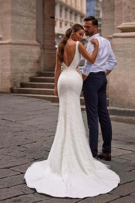 Stunning Mermaid Wedding Dress with Sleeveless Design, Deep Neckline, and Elegant Sequined Embellishments