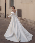 Elegant Sheath Wedding Gown, Long Sleeves, and a Queen Anne Neckline for a Regal and Sophisticated Bridal Look