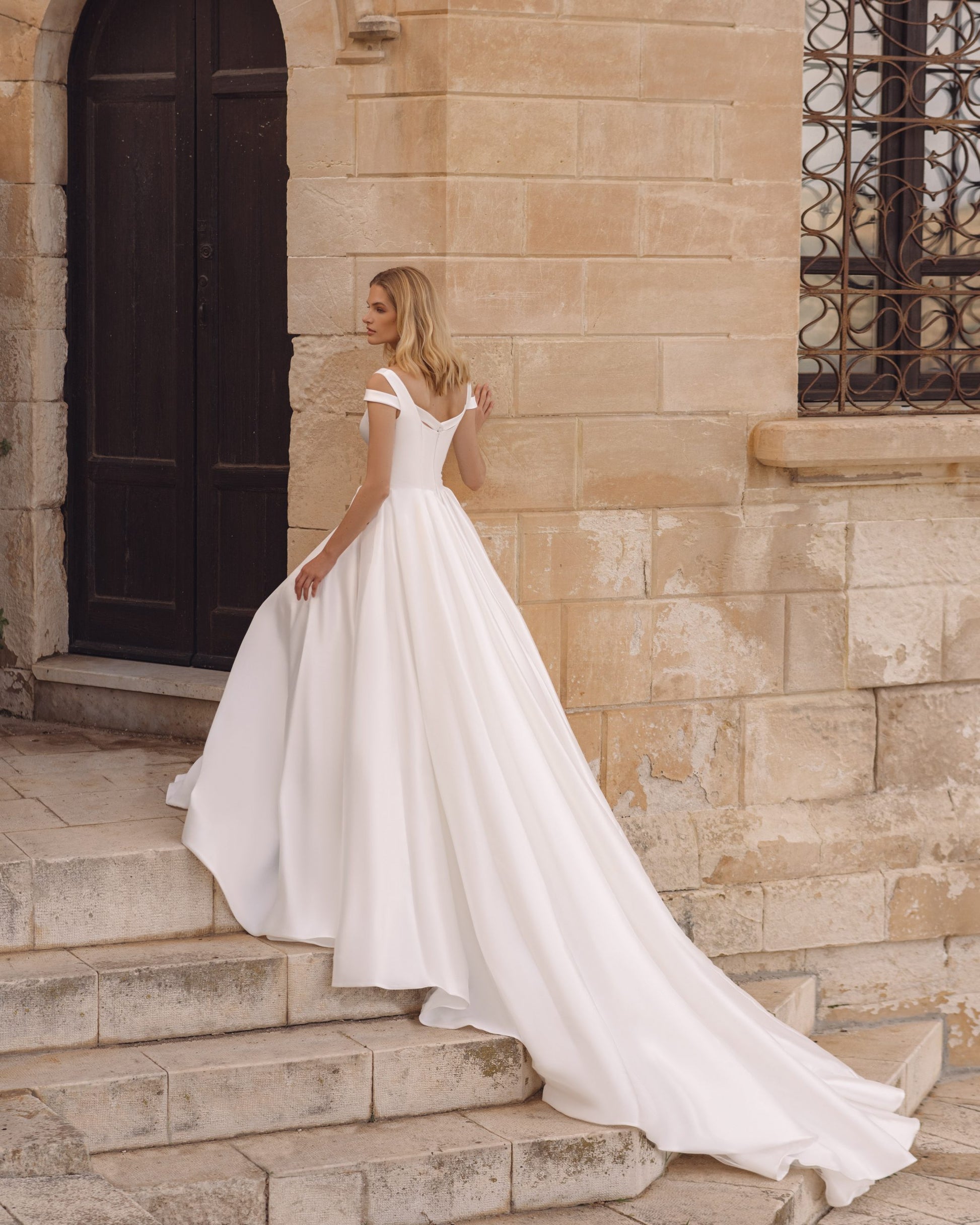 Romantic A-Line Wedding Gown, Off-Shoulder Sleeves, and a Flattering Natural Waistline for an Enchanting Bridal Look