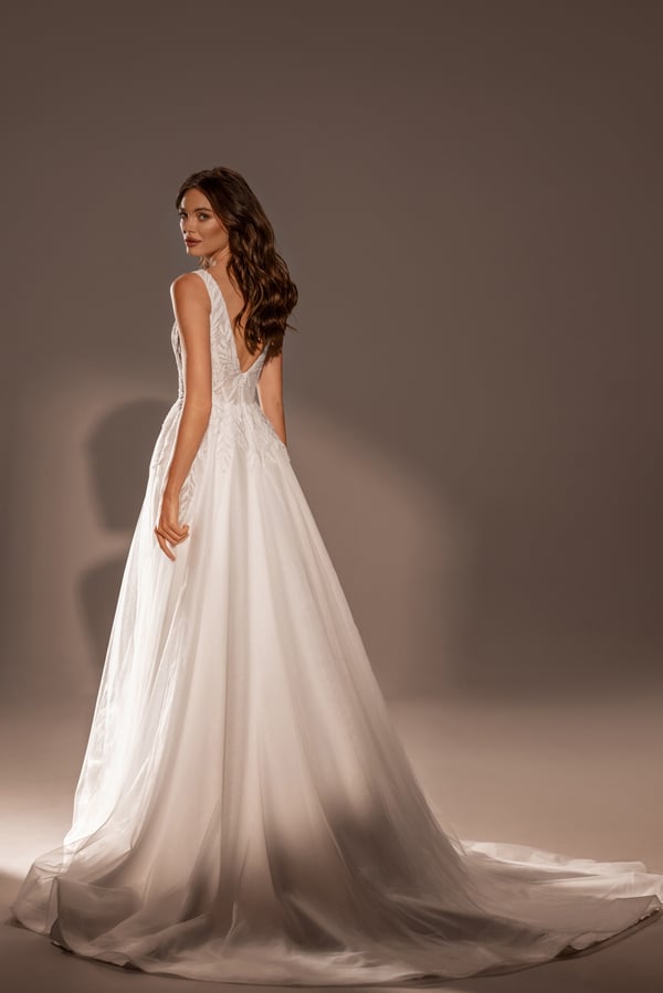 Graceful A-Line Wedding Dress with V-Neckline, Sleeveless Design, and Lace Embellishments