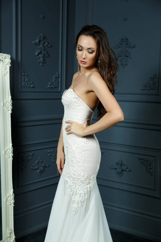 Glamorous Mermaid Wedding Gown with Strapless Sweetheart Neckline, Sparkling Beaded Lace Detailing, and a Flattering Dropped Waist for a Captivating Bridal Look