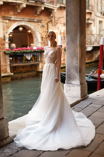 Stunning A-Line Wedding Gown with Cap Sleeves, Boat Neckline, and Elegant Embroidery, Featuring a Natural Waistline for a Timeless Bridal Look