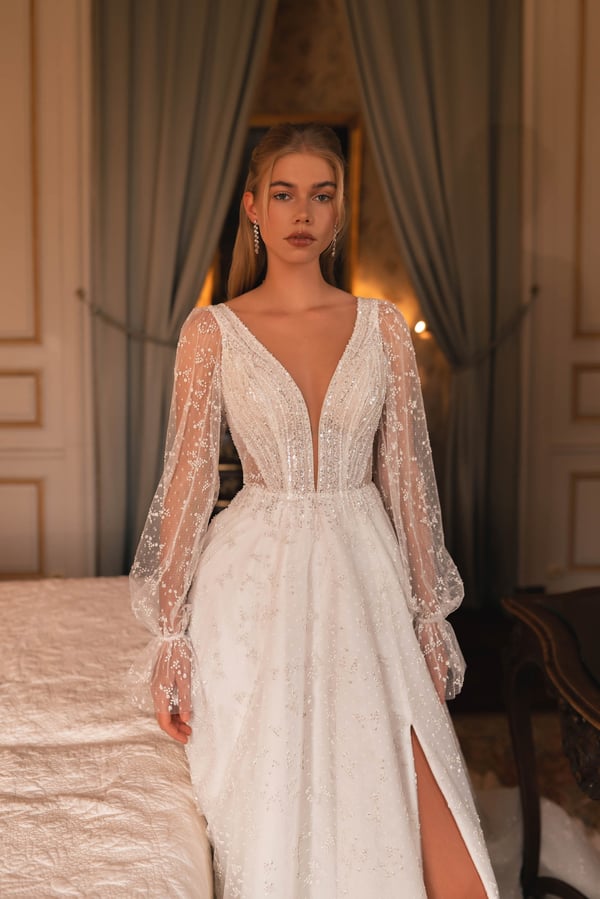 Elegant A-Line Wedding Gown with Puff Sleeves, Deep Neckline, Sequin Embellishments, and a Natural Waistline for a Timeless Bridal Look