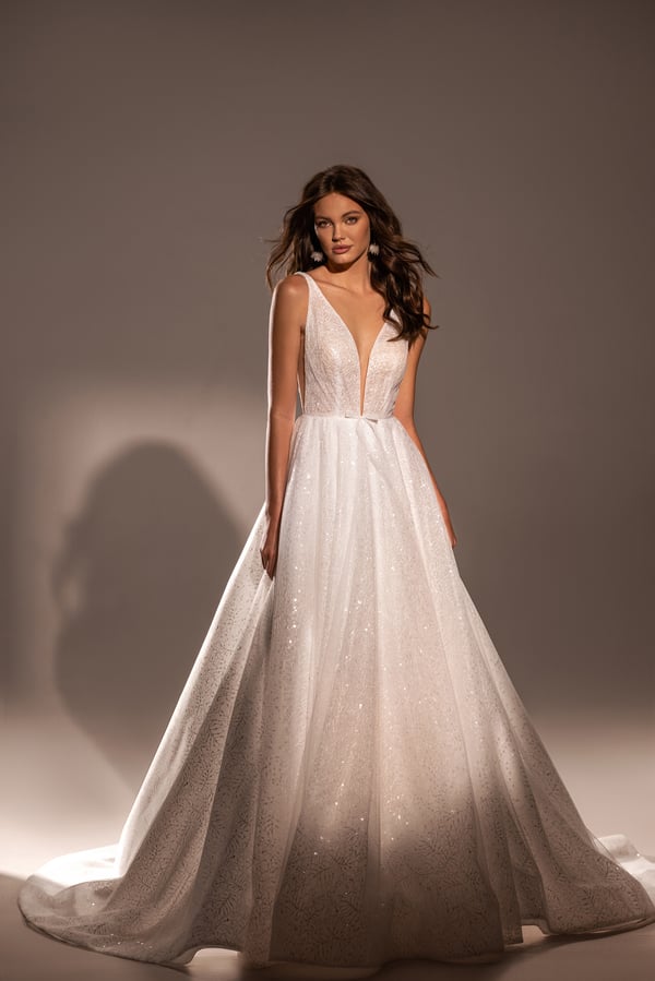 Radiant A-Line Wedding Dress with V-Neckline and Shimmering Fabric