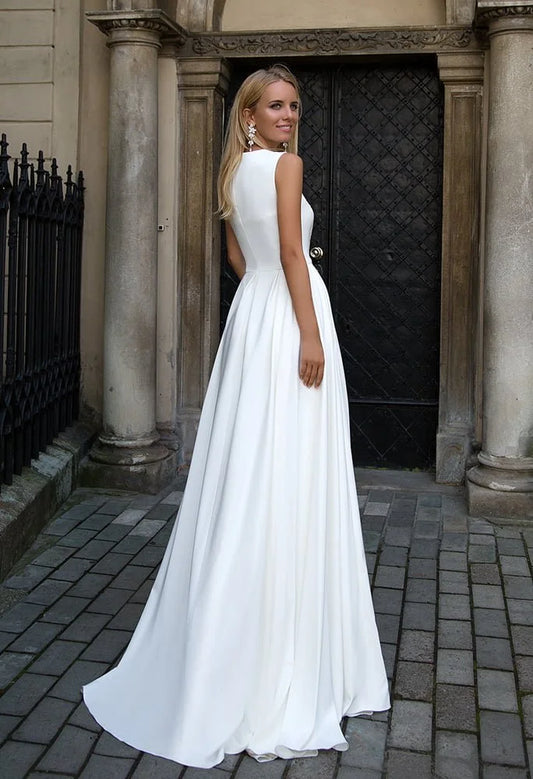 Sleek Sheath Wedding Gown with Strapless Jewel Neckline, Exquisite Lace Detailing, and a Flattering Dropped Waist for a Sophisticated and Timeless Bridal Look