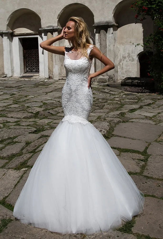 Exquisite Mermaid Wedding Gown with Strapless Illusion Neckline, Delicate Lace Detailing, and a Flattering Dropped Waist for a Breathtaking Bridal Look