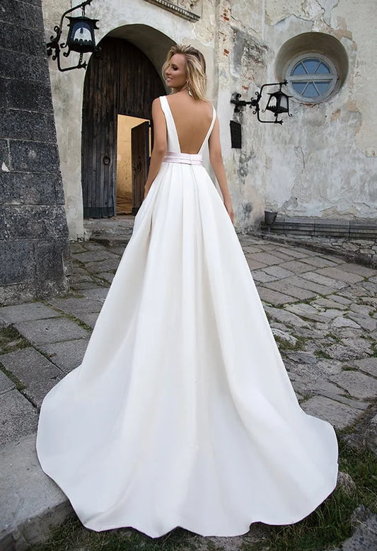 Elegant A-Line Wedding Gown with Spaghetti Straps, Chic Square Neckline, and a Flattering Dropped Waist for a Timeless and Graceful Bridal Look