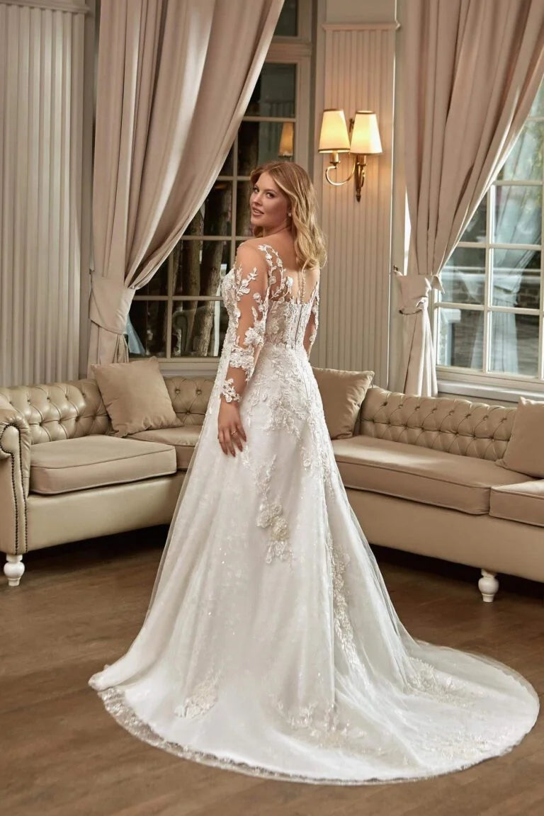 Elegant Plus Size A-Line Wedding Gown with Long Sleeves and Illusion Neckline, Designed with a Flattering Natural Waistline for a Timeless and Graceful Bridal Look