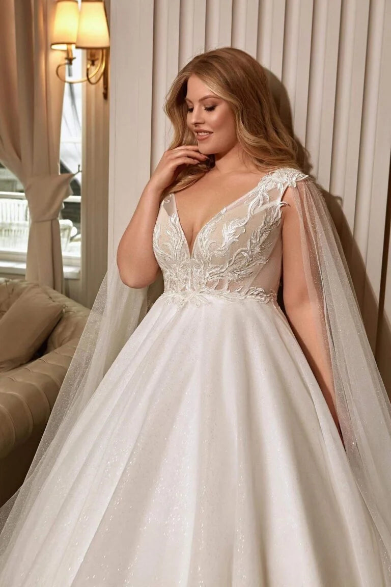 Elegant Plus Size A-Line Wedding Dress with Spaghetti Straps and V-Neckline, Featuring a Flattering Natural Waistline for a Timeless Bridal Look