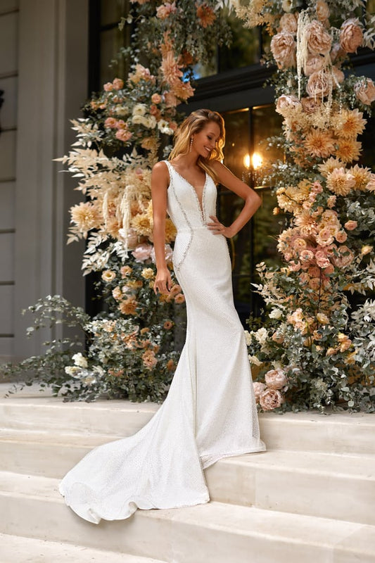 Stunning Mermaid Bridal Dress with Sleeveless Design, Deep Neckline, Pearl Embellishments, and a Natural Waistline for a Perfectly Elegant Look