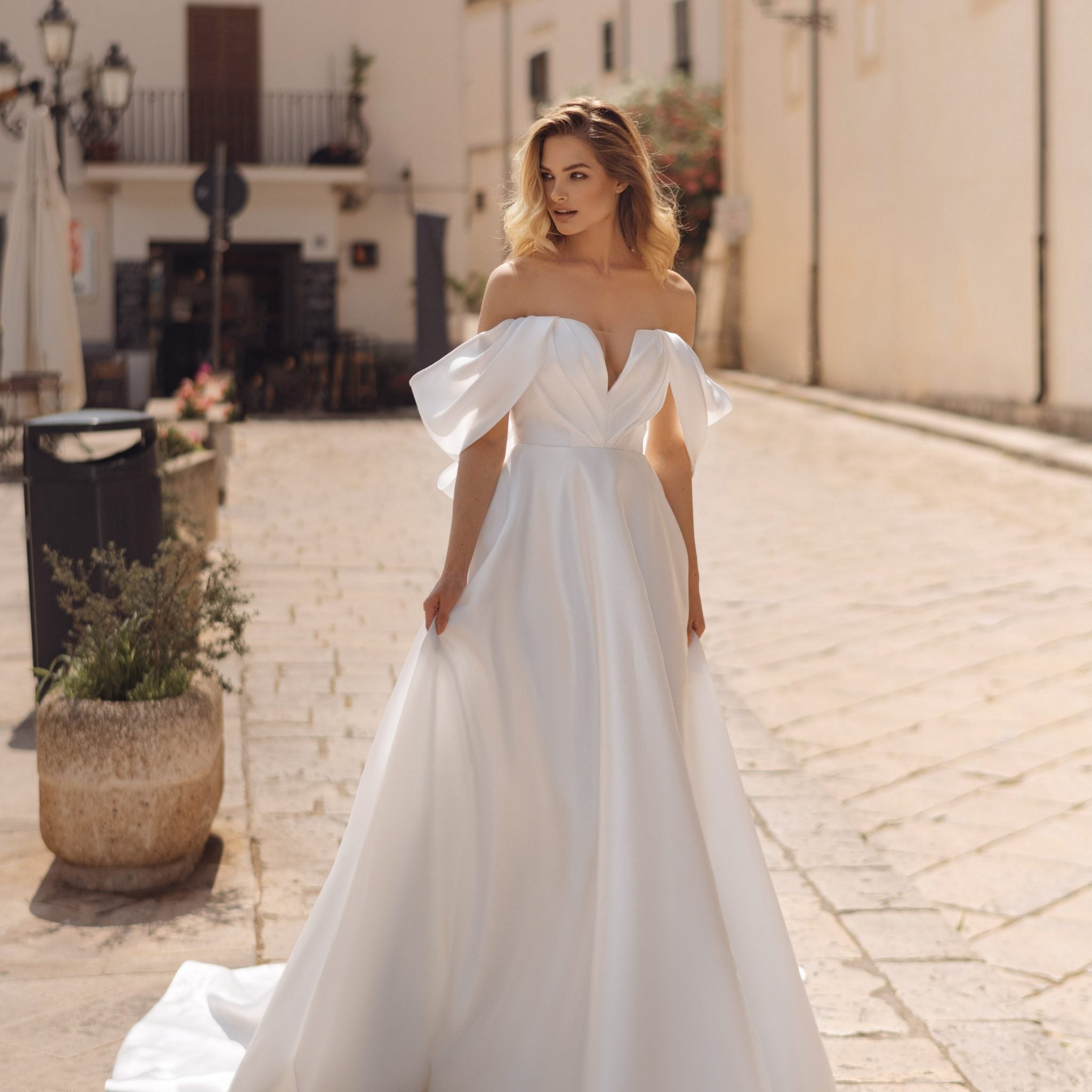 Romantic A-Line Wedding Gown, Off-Shoulder Sleeves, and a Flattering Natural Waistline for an Enchanting Bridal Look