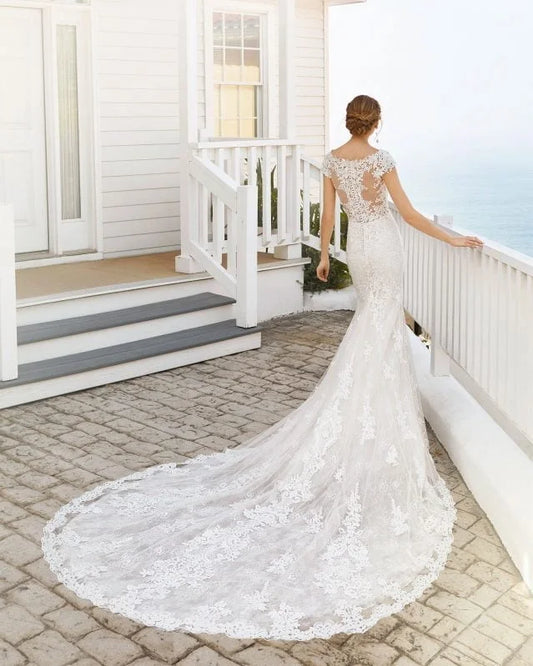 Sophisticated Mermaid Wedding Gown with Cap Sleeves, Elegant V-Neckline, and Exquisite Lace Detailing for a Timeless and Captivating Bridal Look