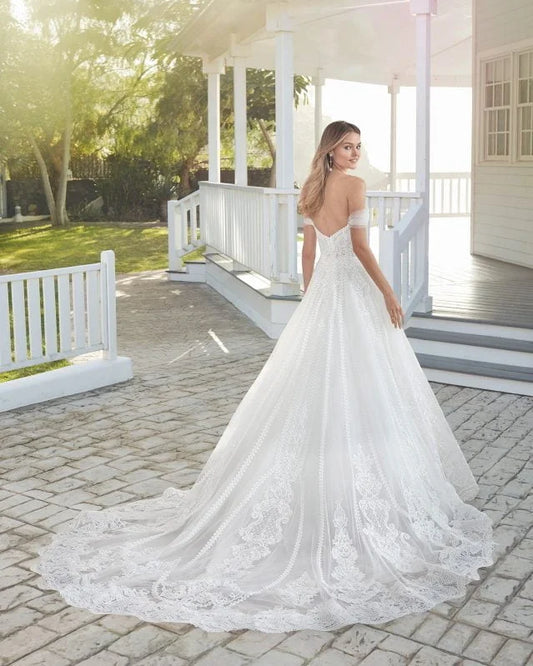 Ethereal A-Line Wedding Gown with Off-the-Shoulder Neckline, Sparkling Beaded Lace Detailing, and a Flattering Natural Waist for a Romantic and Timeless Bridal Look