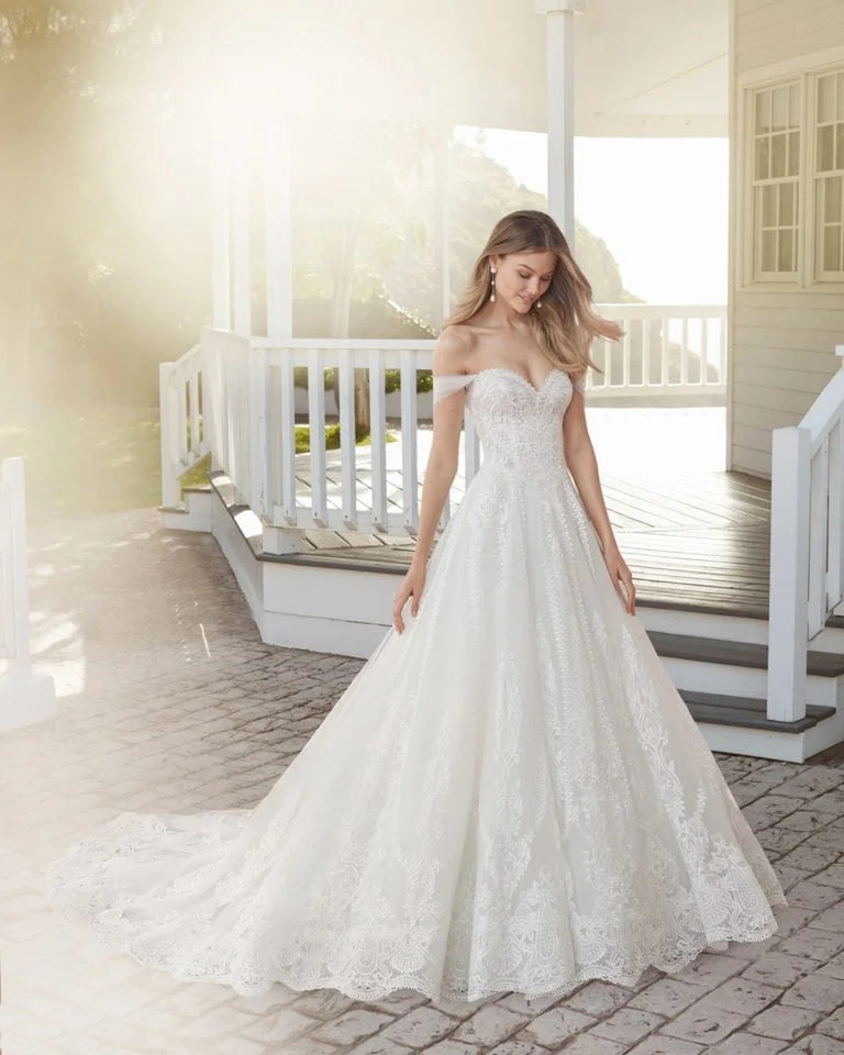 Ethereal A-Line Wedding Gown with Off-the-Shoulder Neckline, Sparkling Beaded Lace Detailing, and a Flattering Natural Waist for a Romantic and Timeless Bridal Look