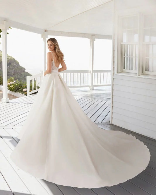 Elegant A-Line Wedding Gown with Delicate Straps, Graceful V-Neckline, Sparkling Beaded Lace Detailing, and a Flattering Dropped Waist for a Timeless and Romantic Bridal Look