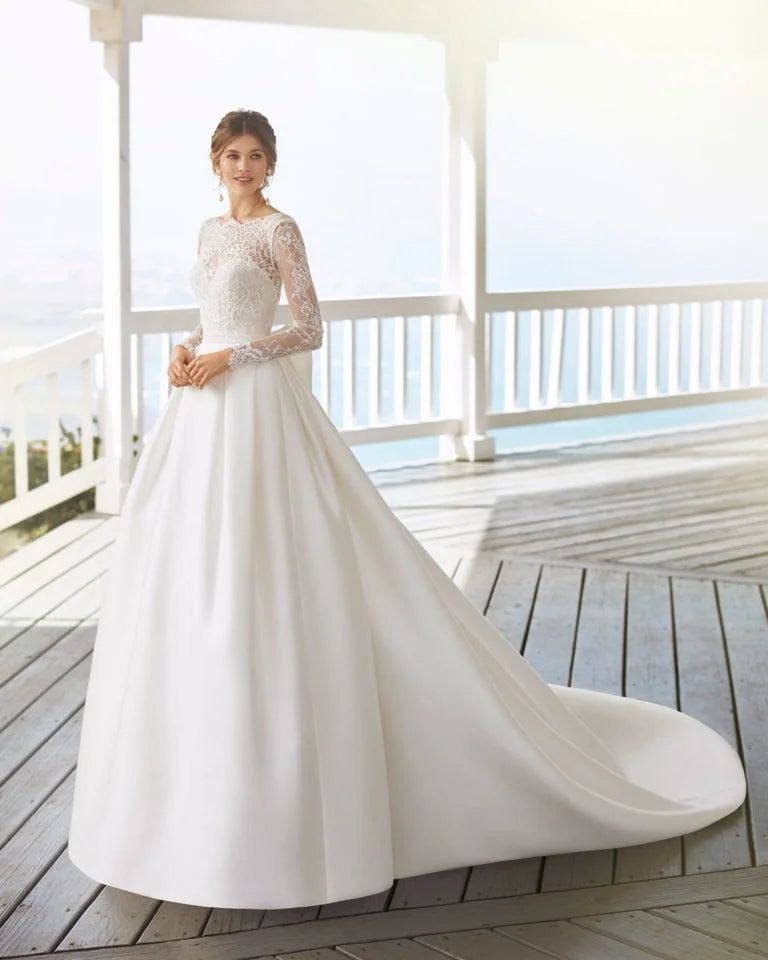 Ethereal A-Line Wedding Gown with Long Sleeves, Delicate Illusion Neckline, and Exquisite Lace Detailing for a Graceful and Timeless Bridal Look